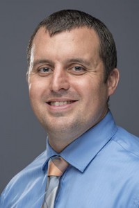 Headshot of person smiling at camera